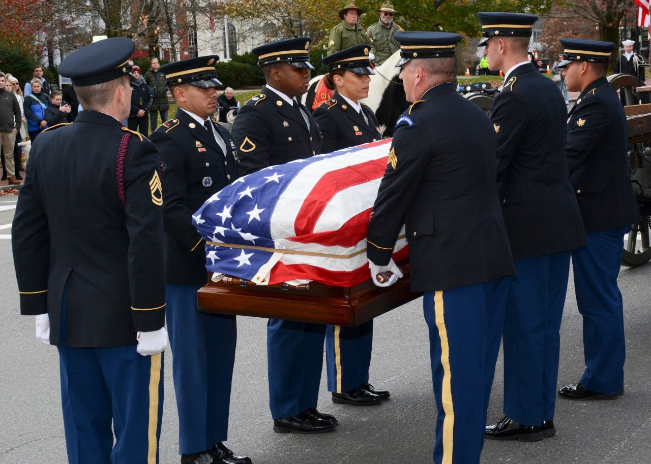 The Military Funeral Honors Team of the Massachusetts Army National Guard carries the casket of Medal of Honor recipient Capt. Thomas j. Hudner, Jr.