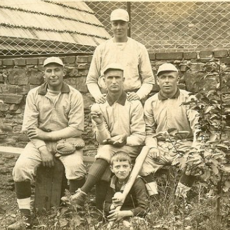 Group of men and child in caps