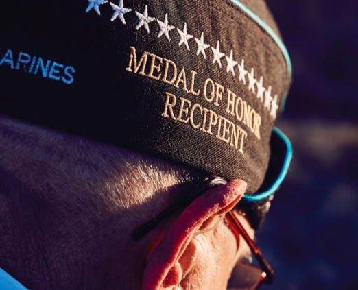 Hershel Williams wearing Medal of Honor recipient hat
