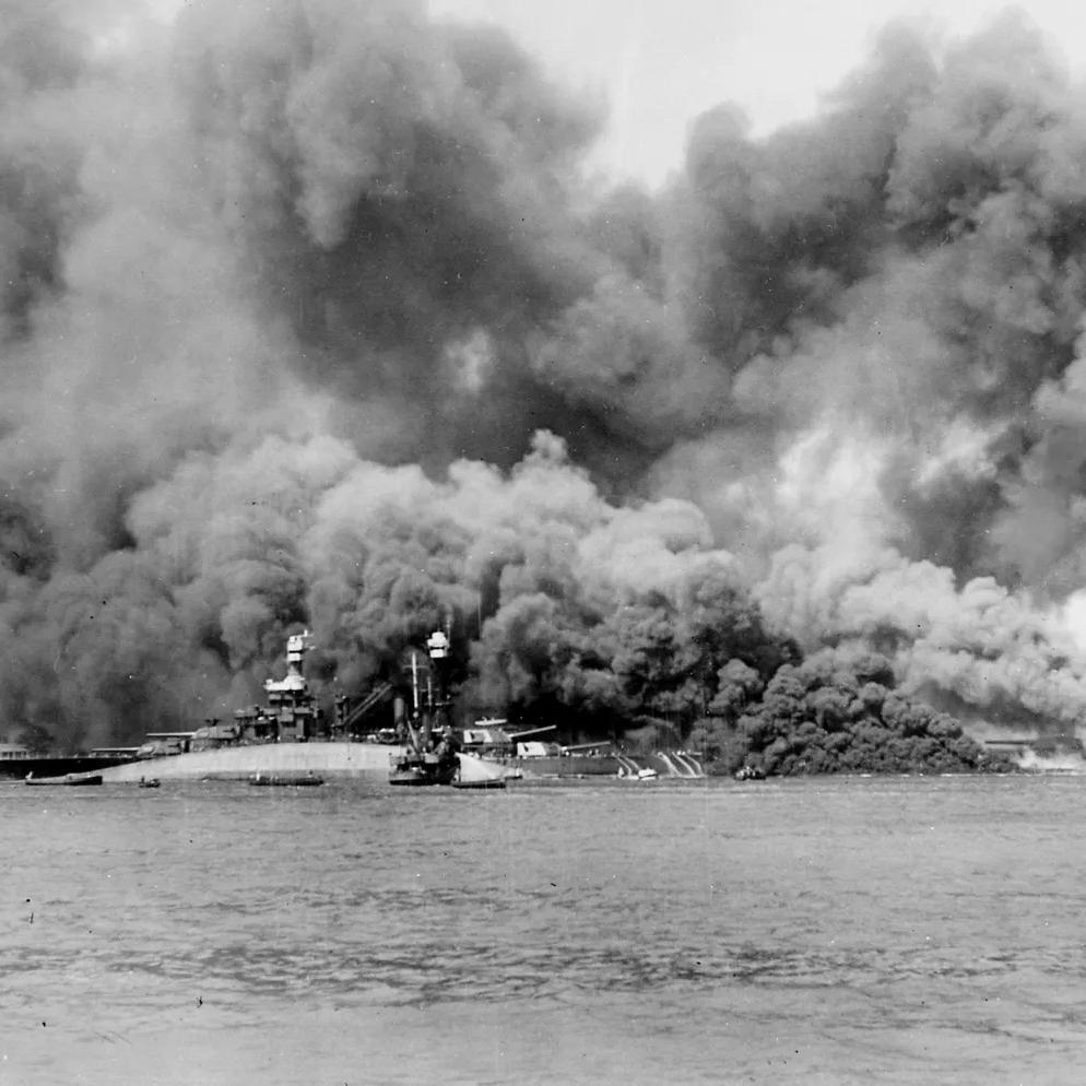 The USS Oklahoma capsizes during the attack on Pearl Harbor.